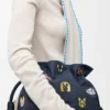 Cats Medium Flamenco Clutch in Embroidered Denim